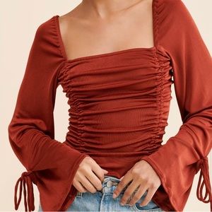 Never worn (tags have been removed), free people - meant to be bodysuit